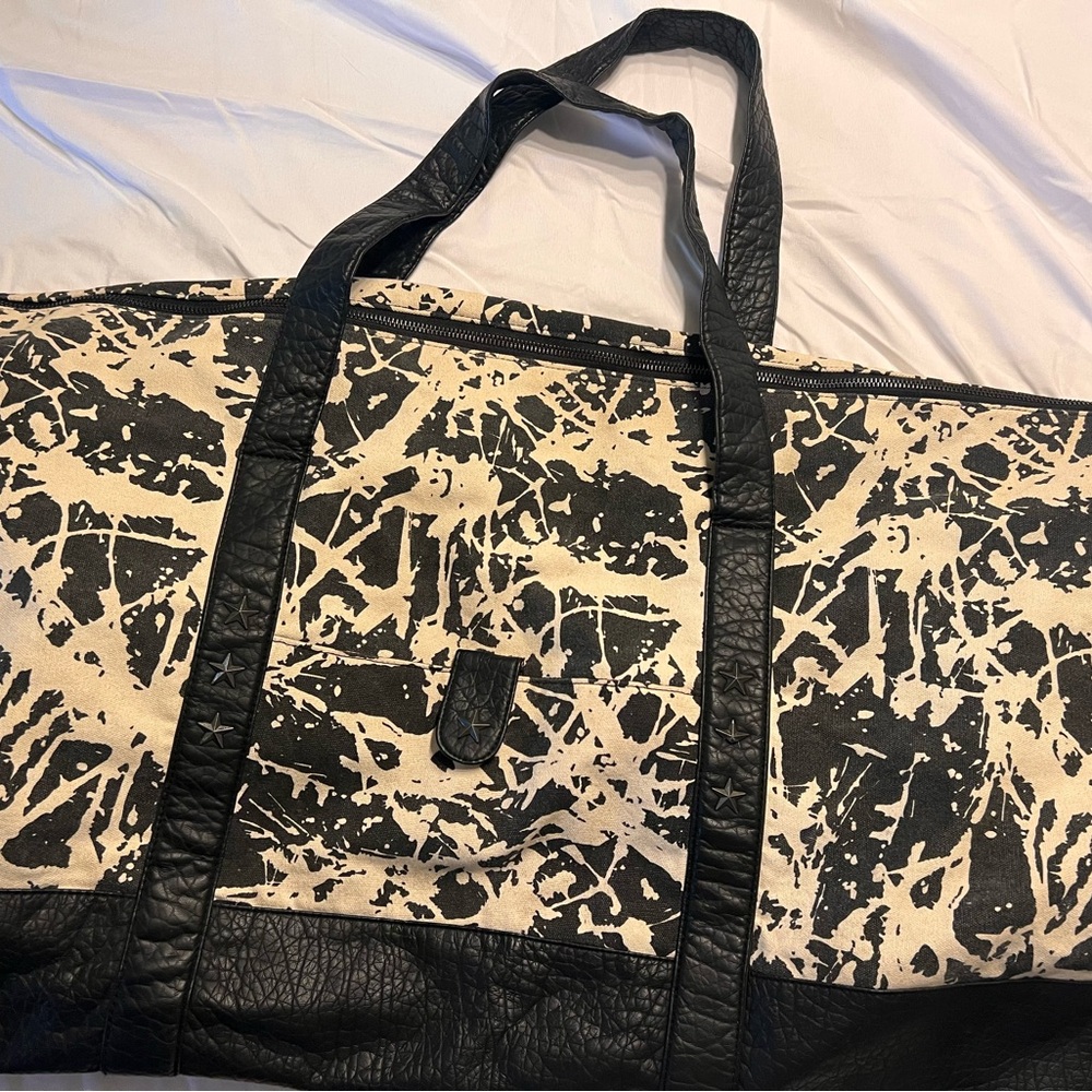Stylish Black and Cream Women’s Weekend Bag. Black star studs
